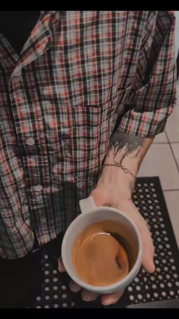 A cappuccino in hand
